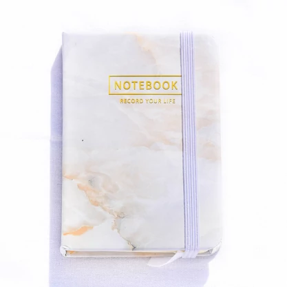 Szürke színű márvány mintás notesz A7